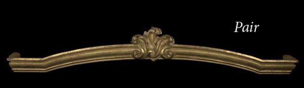 Pair of Louis XV-Style Giltwood Valences: Pair of Louis XV-Style Giltwood Valences, early 20th century, the molded front piece slightly domed and centered by a scrolling foliate shield-form pattern, h. 13", w. 77", d. 10".