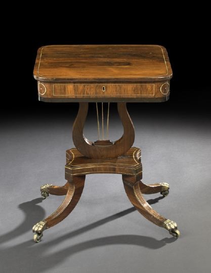 Regency Rosewood Work Table: Regency Rosewood Work Table, first quarter 19th century, the rounded rectangular top with inlaid brass stringing, hinged and opening to a compartmented interior above a like-inlaid frieze, raised on a