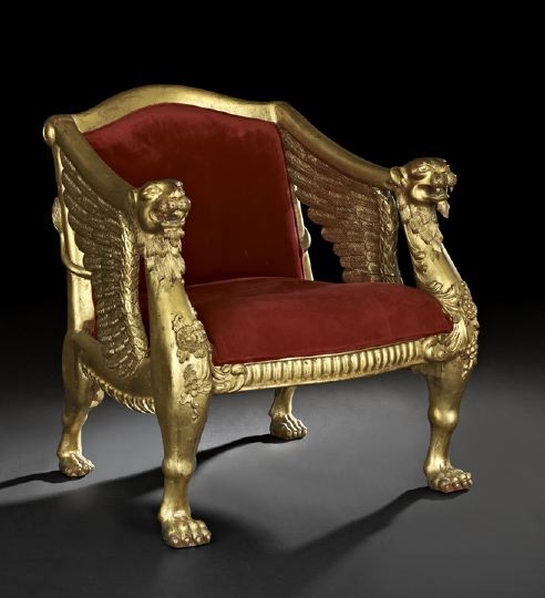 Regency-Style Giltwood Throne Chair: Regency-Style Giltwood Throne Chair, late 19th century, in the manner of Thomas Hope (1769-1831), the padded and slightly domed back joined to the padded seat by downswept arms to winged lion armrests