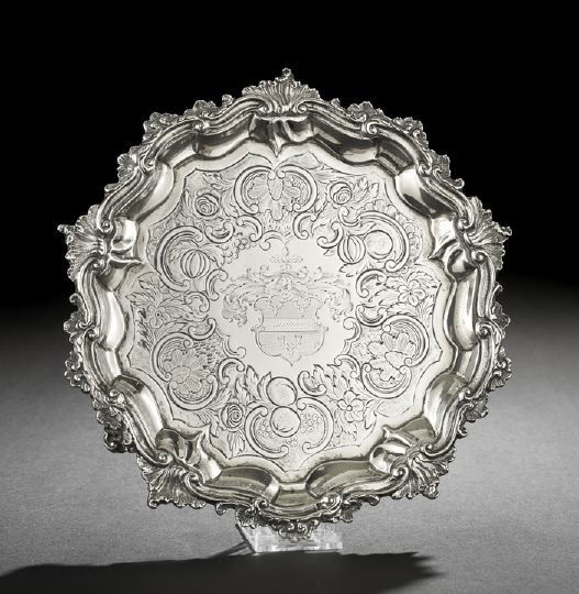George IV Sterling Silver Waiter: George IV Sterling Silver Waiter, hallmarked London, 1829-1830, by John Wakefield, of circular form with rococo shell-and-scroll "Chippendale" rim, the plateau engraved with a wide band of leafy C-scr