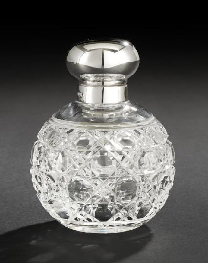 English Silver-Mounted Cut Glass Cologne Bottle: Contemporary English Sterling Silver-Mounted Cut Glass Cologne Bottle, hallmarked Birmingham, 1997, by M. M. Henderson, Ltd., the glass body of spherical form and cut in an octagon-and-diamond pattern