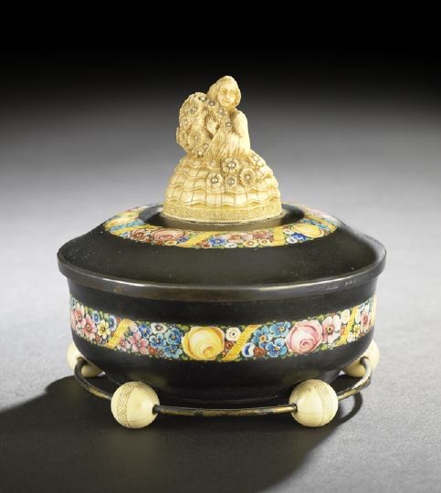 Silver, Enamel and Ivory "Jenny Lind" Dresser Jar: German .935 Silver, Enamel and Ivory "Jenny Lind" Dresser Jar, with London import marks for 1926-1927, sponsored by KA & Co., of circular form, the silver body covered entirely in niello and decorated