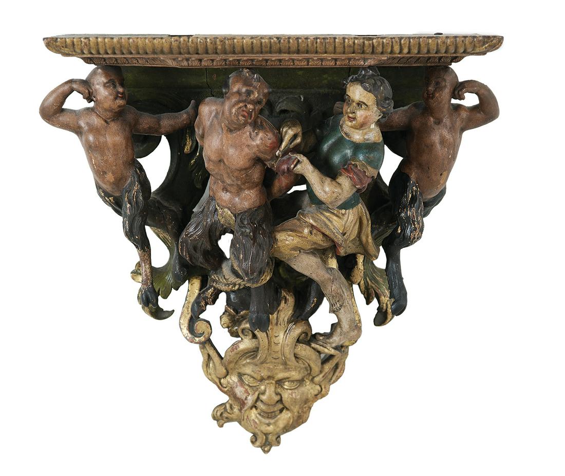 Carved and Painted Bracket of a Bound Satyr: Carved and Painted Bracket of a Bound Satyr 17th century and later, probably Italian, possibly depicting the myth of Apollo and Marsyas, the figures against a ground of scrollwork, with a masque of Be