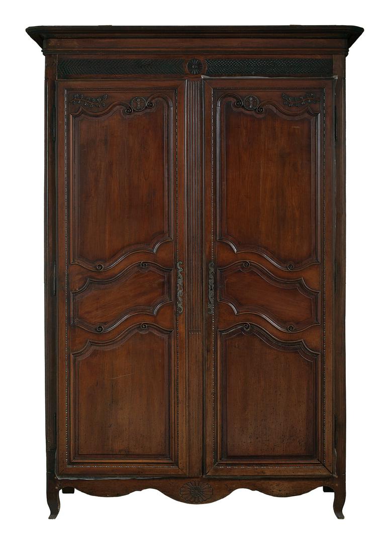 French Provincial Fruitwood Armoire: French Provincial Fruitwood Armoire 18th century, with a molded wraparound cornice above a pair of framed and paneled doors, raised on short cabriole legs. h. 98", w. 65", d. 26"