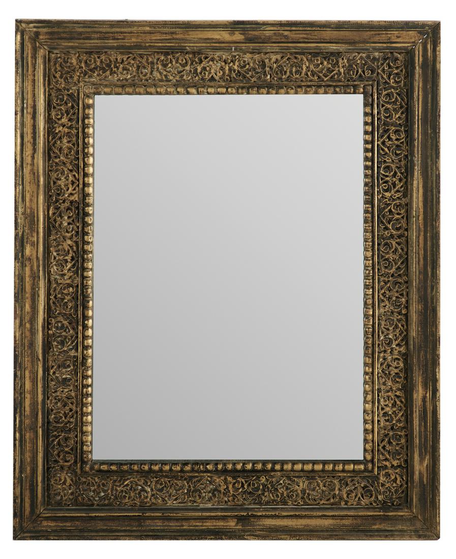 Carved and Painted Mirror in the Moroccan Taste: Carved and Painted Mirror in the Moroccan Taste 20th century, with a molded surround framing carved scrollwork and leaf design, the mirror plate with a beaded liner. h. 48-1/2", w. 60-1/2"