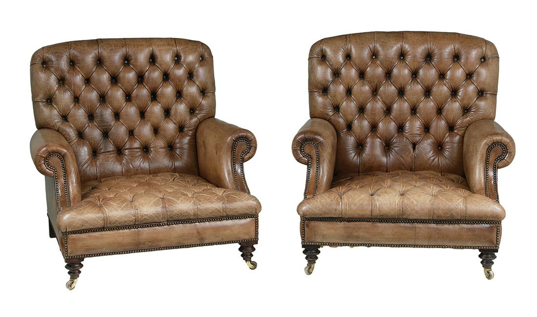 Pair of Victorian Leather and Mahogany Armchairs: Pair of Victorian Leather and Mahogany Armchairs late 19th/early 20th century, each with a tufted back joined to closed cylindrical armrests on shaped supports, with a tufted seat cushion and turned f