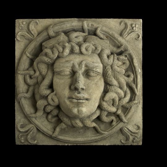 Edwardian Cast-Stone "Medusa Mask" Garden Plaque: Large Edwardian Cast-Stone "Medusa Mask" Garden Plaque, first quarter 20th century, the surface weathered throughout, h. 18-1/2", w. 18-1/2".