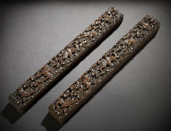 Pair of Chinese Rosewood Scroll Weights: Fine, Well-Carved Pair of Chinese Rosewood Scroll Weights, late 19th century, each of rectangular form, the tops intricately carved with five bats flying among scrolling clouds, the sides and bases ca