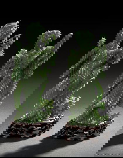 Pair of Chinese Carved Spinach Jade Figures: Pair of Chinese Carved Spinach Jade Figures of Female Deities, each standing deity clad in flowing robes, one holding a lantern, the other holding a fly whisk and a flower, the stone of rich spinach c