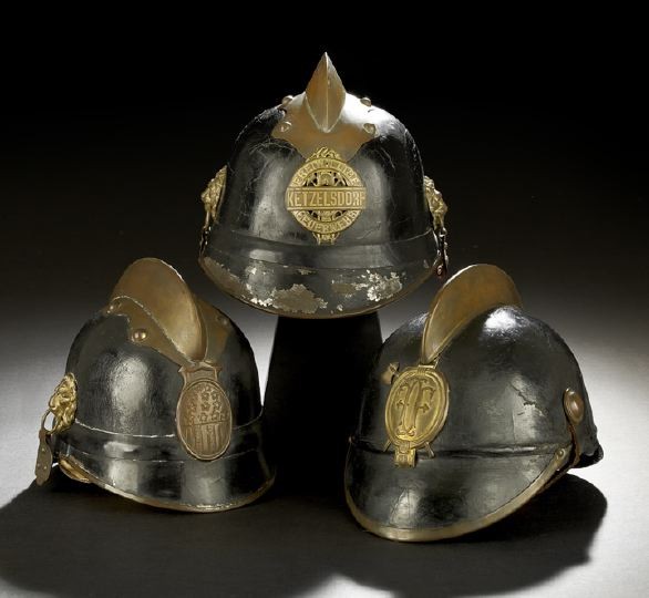 Trio of Austro-Bavarian Pre-WWI Fire Helmets: Trio of Austro-Bavarian Pre-WWI Steel, Leather and Brass Fire Helmets, late 19th/early 20th century, each in the traditional Bavarian form, two with a leather-covered steel crown and black-painted ste