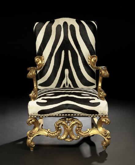 Baronial-Style Giltwood Fauteuil: Baronial-Style Giltwood Fauteuil, early 20th century, by Ralph Lauren, the shaped and padded back joined by scrolling foliate-carved arms to the padded seat, raised on exaggerated scrolling legs joine