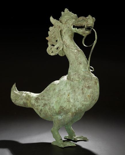 Southeast Asian Hollow Cast Bronze Figure: Southeast Asian Hollow Cast Bronze Figure of a Mythical Beast, cast as a creature with the body of a goose and the head of a dragon, with feathered ears, hairy nostrils and long flattened tongue, h. 3