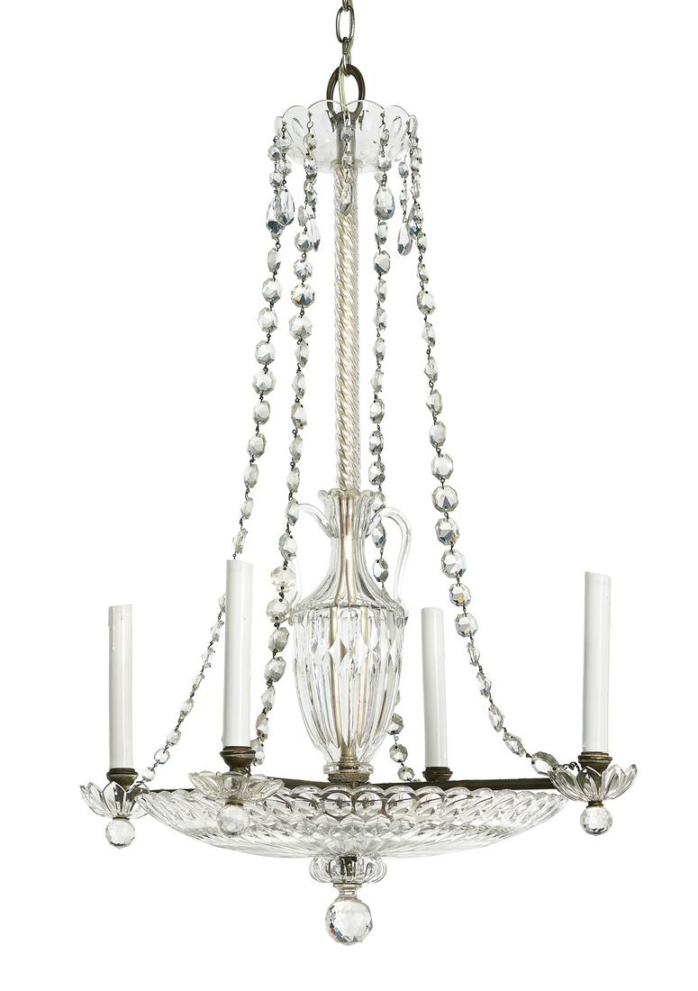 Edwardian Chandelier in the Regency Taste: Edwardian Chandelier in the Regency Taste first quarter 20th century, with a molded glass pan, the standard clad with a glass "vase" and rope-twist turning, supporting a prism ring with strands of dro