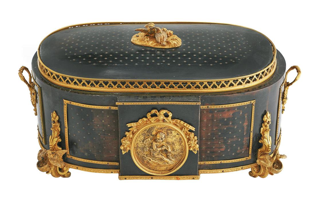Napoleon III Gilt-Bronze and Wood Jardiniere: Napoleon III Gilt-Bronze and Ebonized Wood Jardiniere third quarter 19th century, the oval body set with a pierced gallery around the cover, the facade with a bas-relief bronze mount of Eros, the bron