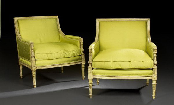 Pair of Louis XVI-Style Polychromed Bergeres: Pair of Louis XVI-Style Polychromed Bergeres, the padded rectangular backs within a molded frame, joined by padded arms and turned uprights to cushioned seats, raised on stop-fluted tapering circular 