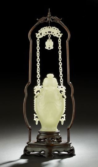 Fine Chinese Carved White Jade Hanging Vase: Fine Chinese Carved White Jade Hanging Vase, 19th century, the even white translucent stone carved as a flattened baluster-form vase of two conjoined fish with flanged and ribbed sides with two sets o