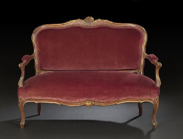 Louis XV-Style Parcel-Gilt Walnut Settee: Louis XV-Style Parcel-Gilt Walnut Settee, ca. 1900, the serpentine crest rail centered by a pair of carved flowers, extending to open arms, with serpentine seat rail and cabriole legs, h. 40", w. 54",