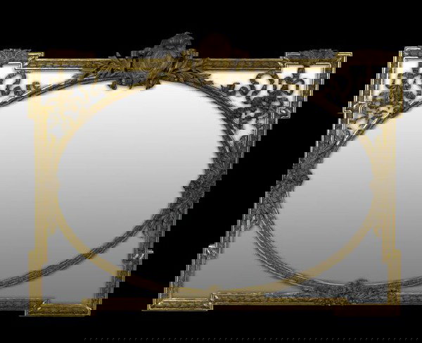 Large French Earred Overmantel Mirror: Large French Earred Overmantel Mirror, fourth quarter 19th century, composed of carved giltwood and plaster in the Louis XVI taste, the primary aperture oval, with four surrounding spandrels with gilt