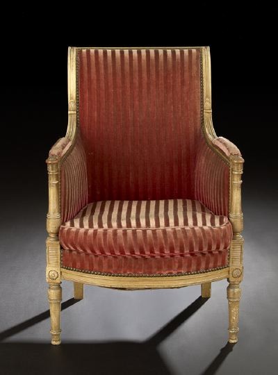 Empire-Style Polychromed Bergere: Empire-Style Polychromed Bergere, late 19th century, the padded backswept back joined by padded arms on turned uprights to the cushioned seat, raised on turned and tapering circular legs ending in peg