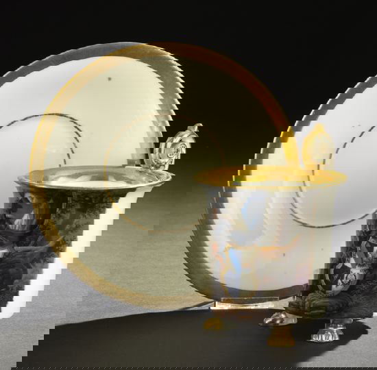 Fine, Large KPM Porcelain Cup and Saucer: Fine, Large Royal Berlin (KPM) Porcelain Cup and Saucer, 1847-1849, the facade of the cylindrical, tripodal, paw-footed cup polychromed with the portrait of a seated brooding warrior king, with the co