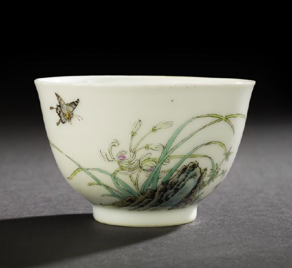 Brilliant Chinese Famille Rose Porcelain Tea Cup: Brilliant Chinese Famille Rose Porcelain Tea Cup, exquisitely decorated with orchids and bamboo sprouting from a rocky outcrop and two butterflies in flight, all against a white ground, the enamels st