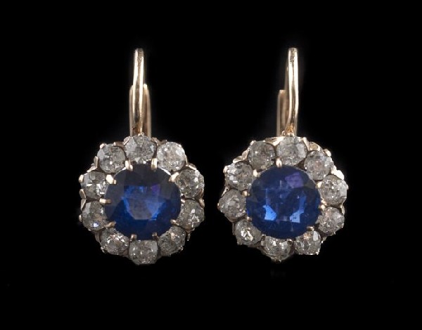 Pair of Edwardian Sapphire and Diamond Earrings: Good Pair of Edwardian Sapphire and Diamond Earrings, ca. 1900, each with a central round sapphire (one estimated at .56 carats, the other at .73 carats), surrounded by ten old mine-cut diamonds (twen