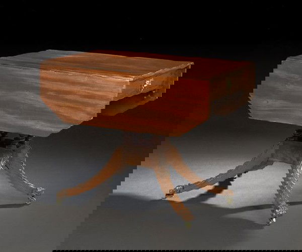 American Classical Mahogany Pembroke Table: American Classical Mahogany Pembroke Table, first quarter 19th century, school of Duncan Phyfe, New York, the figured single-board top flanked by a pair of like drop leaves with canted corners, the fr