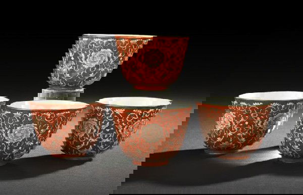 Four Chinese Iron-Red Decorated Tea Cups: Set of Four Chinese Iron-Red Decorated Porcelain Tea Cups, of conventional form, decorated on the exterior in iron-red ground with a continuous scene of peonies and scrolling foliage in white, the rec