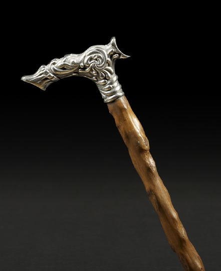 American Sterling Silver and Briarwood Cane: American Sterling Silver and Briarwood Cane, fourth quarter 19th century, by Simons, Brother & Co., Philadelphia, Pennsylvania, the "gunstock" sterling silver handle decorated with embossed stylized s