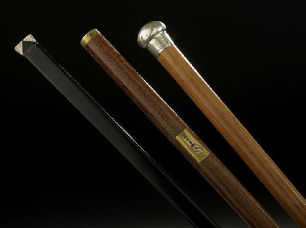 Collection of Three Stylish Walking Sticks: Collection of Three Stylish Walking Sticks, the first Anglo-Colonial with a sterling silver pommel hallmarked London, 1925-1926, by Henry Howell & Co., malacca shaft and horn tip, l. 34-1/2"; the seco