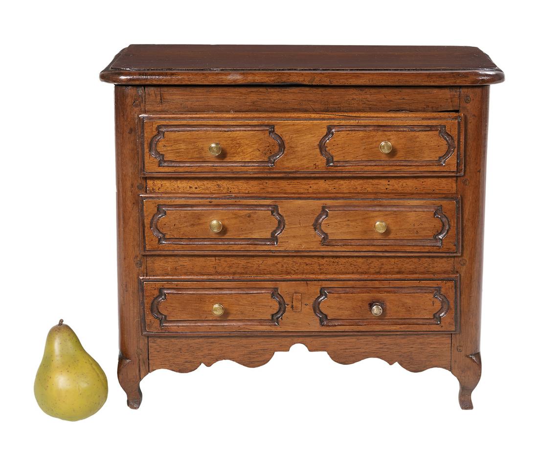 Louis XIV-Style Carved Walnut Miniature Chest: Louis XIV-Style Carved Walnut Miniature Chest 19th century and later, with a molded top edge, carved panels on the drawer fronts and sides, and a scalloped skirt. h. 15", w. 16-1/2", d. 9-1/2"