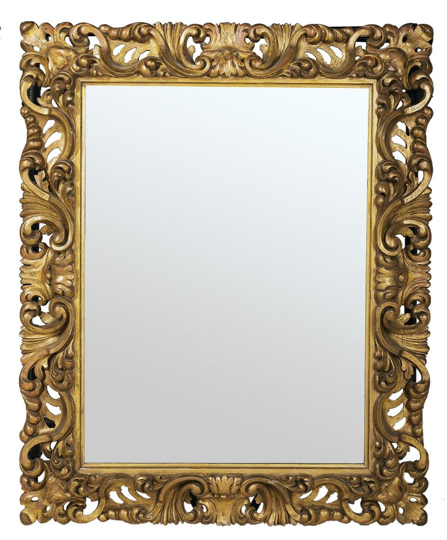 Carved and Pierced Giltwood Mirror: Carved and Pierced Giltwood Mirror in the Baroque Taste fourth quarter 19th century, Italian or Spanish, the bold ogee-form surround carved with scrollwork, leaves and piercing, set with a beveled mir