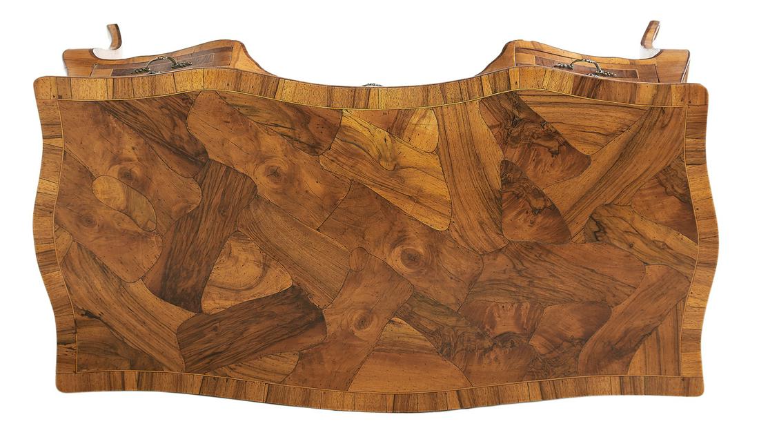 Italian Rococo-Style Olive Wood Desk: Italian Rococo-Style Olive Wood Desk the serpentine top over a conforming case of kneehole form, the center drawer flanked by banks of two shaped drawers, raised on cabriole legs. h. 31-1/2", w. 53", 