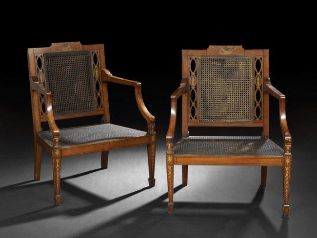 Pair of Edwardian Satinwood Armchairs: Pair of Edwardian Satinwood Armchairs, ca. 1900, in the Adam taste, each with a shaped crest centered by a polychromed medallion of a classical maiden, above a caned back flanked to either side by ova