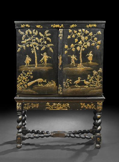 Dutch Colonial Japanned Cabinet: Dutch Colonial Japanned Cabinet, 18th century and later, the molded rectangular cornice above a conforming case fitted with two cabinet doors, each with a gilt and gesso design of an exotic Indian lan