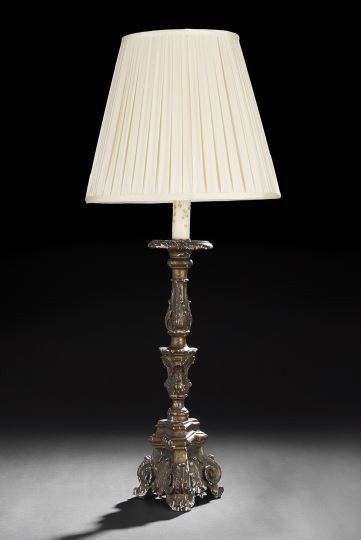 Tall Italian Carved Giltwood Pricket Candlestick: Italian Carved Giltwood Tripodal Pricket Candlestick, fourth quarter 18th century, in the neoclassical taste, now mounted as a table lamp and fitted with a custom flute-pleated silk shade of "old ivor