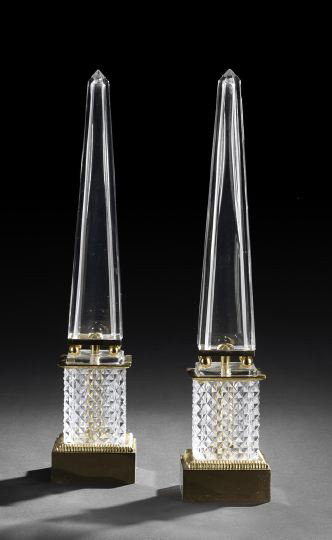 Pair of French Gilt-Brass-Mounted Glass Obelisks: Pair of French Gilt-Brass-Mounted Cut Glass Obelisks, in the Louis XVI taste, the obelisk points channel-cut, the square-section bases diamond-cut, h. 21".