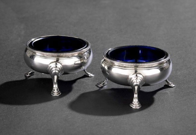 Pair of Hester Bateman Sterling Salt Cellars: Pair of George III Hester Bateman Sterling Silver Salt Cellars, hallmarked London, 1785-1786, by Hester Bateman, each of bulbous circular form with beaded rim and raised on three stepped pad feet, fit