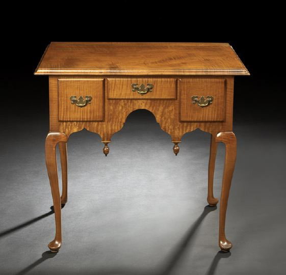 American Colonial Revival Figured Maple Lowboy: American Colonial Revival Figured Maple Lowboy, ca. 1900, in the Queen Anne style, the molded top over a shallow central door flanked by a pair of deeper drawers, with a scalloped apron, cabriole legs