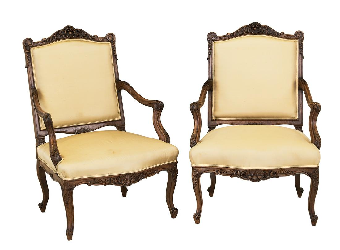 Pair of Louis XV/XVI-Style Fruitwood Fauteuils: Pair of Transitional Louis XV/XVI-Style Fruitwood Fauteuils early 20th century, each with a padded rectangular back surmounted by a foliate shield crest, joined by out-scrolled arms to the padded seat