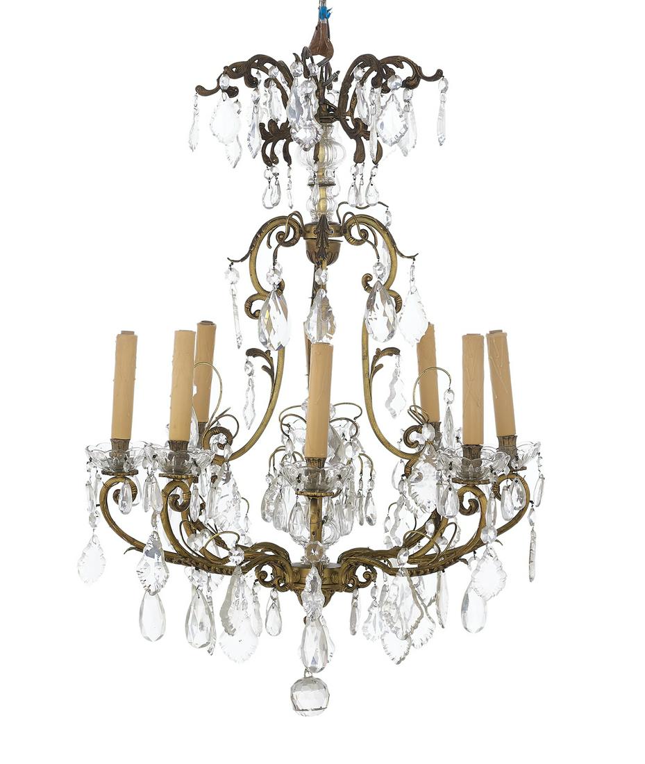 French Bronze and Crystal Chandelier: French Bronze and Crystal Chandelier in the Baroque Taste second quarter 20th century, the eight-light chandelier with a reeded frame decorated with molded leaves and an interior with a glass finial, 