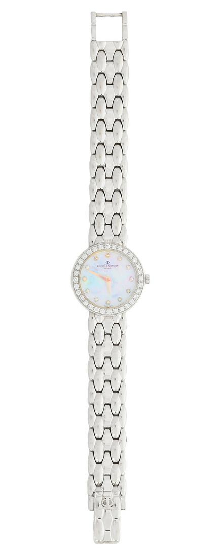 Lady's Baume & Mercier Diamond Quartz Watch: Lady's Baume & Mercier Diamond Quartz Watch 14k white gold, the watch with a round mother-of-pearl face stamped "BAUME & MERCIER GENEVE, SWISS MADE", the bezel and marker accented with round brilliant