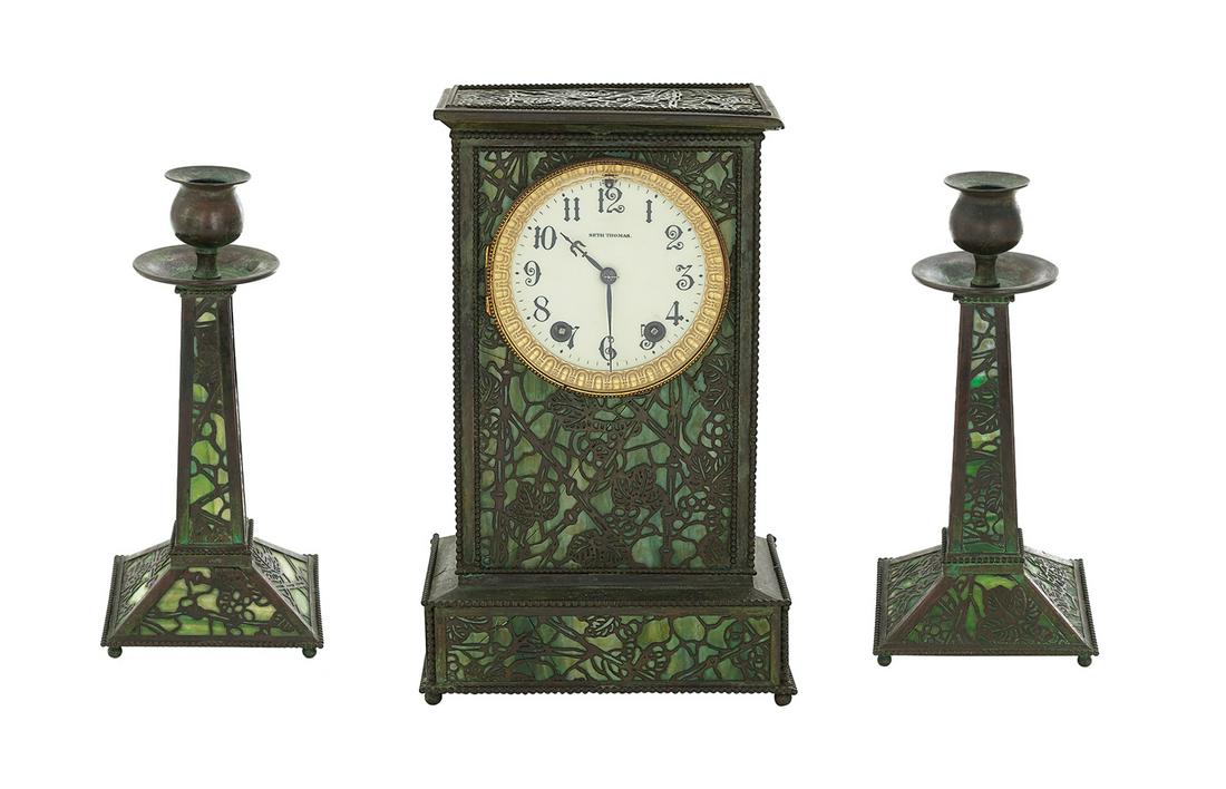 Copper and Glass Clock Set: Copper and Glass Clock Set, Attributed to Riviere Studios, New York first quarter 20th century, decorated with patinated copper panels pierced in the "Grapevine" pattern, set over green slag glass pan
