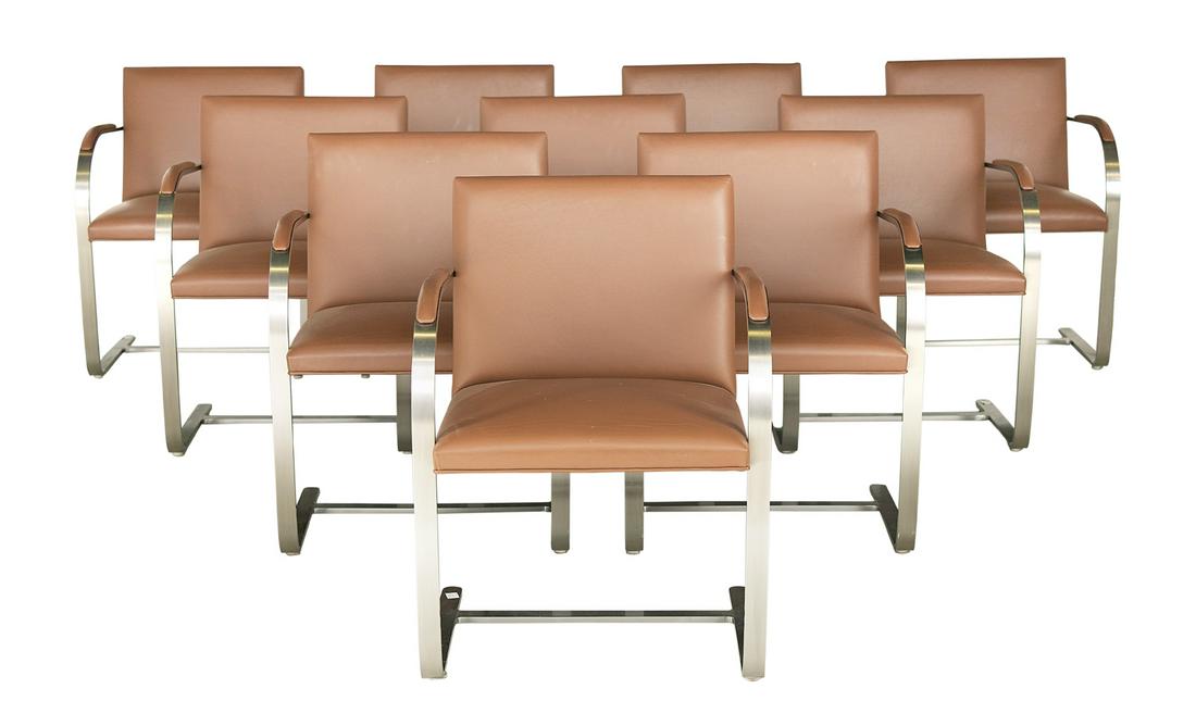 Ten Brueton Leather and Steel Dining Chairs: Suite of Ten Brueton Terracotta Leather and Steel Dining Chairs ca. 1980, New York, the cantilevered satin-polished steel flat-bar frames with leather-upholstered seats and armrests, with Brueton fabr