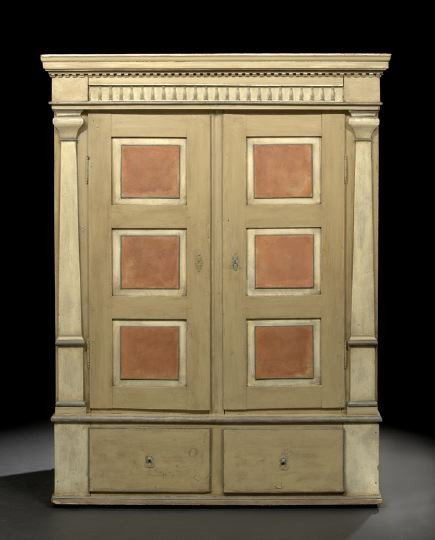 Northern European Polychromed Armoire: Northern European Polychromed Armoire, second quarter 19th century, the molded and dentillated cornice above a baluster-carved frieze, over two tri-paneled doors flanked to either side by engaged upri