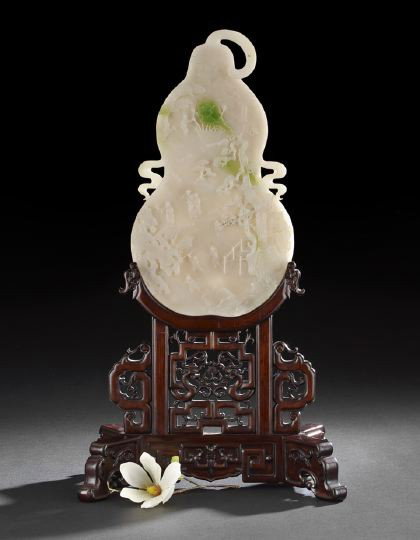 Fine Chinese Carved Jadeite Plaque Screen: Fine Chinese Carved Jadeite Plaque Screen, 20th century, the white stone with bright apple green inclusions, the flat plaque carved in the shape of a double gourd with a twisted stem and ribboned hand