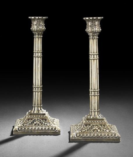 Pair of Edwardian Silverplate Candlesticks: Pair of Edwardian Silverplate Cluster-Column Candlesticks, first quarter 20th century, in the Elizabethan revival taste, each with a cluster column above a foliate-decorated square base with ovolo bor