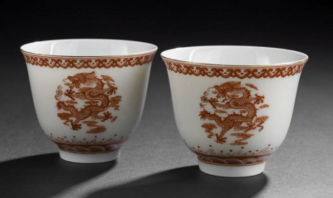Fine Pair of Chinese Iron-Red Porcelain Tea Cups: Fine Pair of Chinese Iron-Red Porcelain Tea Cups, Daoguang mark and probably of the period (1821-1850), each of inverted bell shape and finely enameled in iron red with Imperial Dragons among clouds a