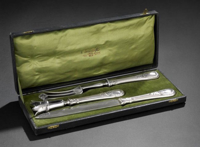 Cased Christofle Silverplate 3-Piece Carving Set: Cased Christofle Silverplate Three-Piece Carving Set, first quarter 20th century, Paris, including a carving knife, l. 13", a carving fork, l. 11-1/2", and a joint holder, l. 8-1/2", each with a spatu