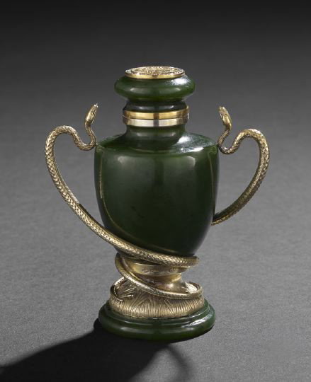 Fauxberge Silver-Gilt-Mounted Jade Cabinet Urn: "Fauxberge" Silver-Gilt-Mounted Jade Cabinet Urn, late 20th century, the carved spinach jade urn with silver-gilt snake-handled mount, the cap set with a medallion of the Imperial arms surrounded by s